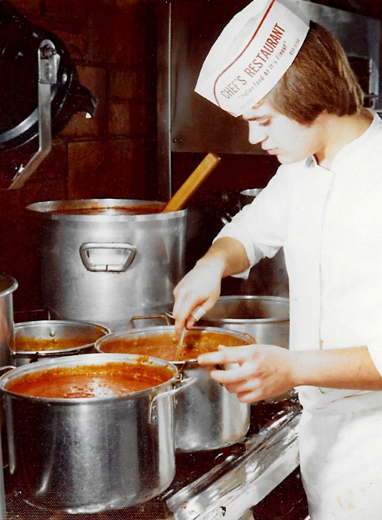 louJr-cooking-sauce young Lou Jr checking on sauce